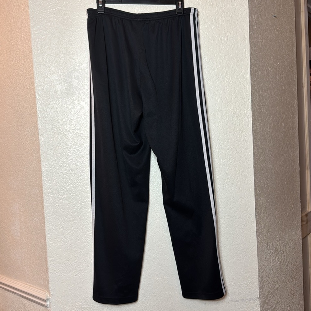 Adidas Men’s Black Track Pants with White Stripes.